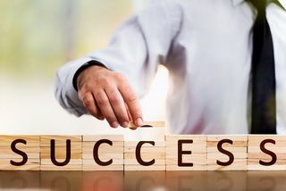 Concept For Success In Business With Wooden Toy Blocks