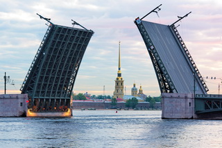View of the Peter and Paul fortress and raised Palace bridge in summer white nights, St. Petersburg
